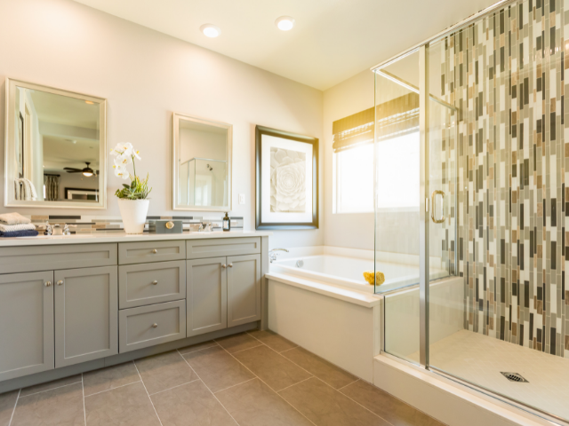 modern updated bathroom mosaic tile glass shower large tub